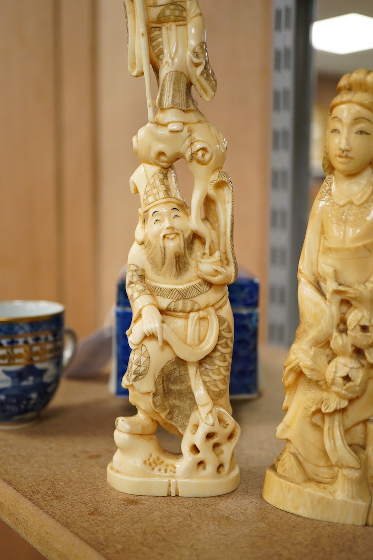 Two early 20th century Japanese walrus ivory carvings, 26cm